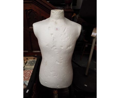 A polystyrene made mannequin on an adjustable beech and chrome stand    