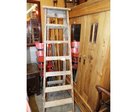A vintage pine seven tread step ladder