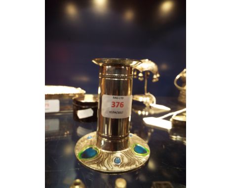 A 20thC pewter pillar candlestick with enamelled peacock feather design to base, fully marked for A R Wentworth of Sheffield,