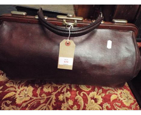 A vintage leather Gladstone bag, the front painted