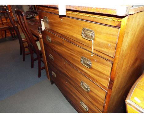 An Edwardian mahogany and satinwood strung chest of four long graduating drawers resting on bracket feet 