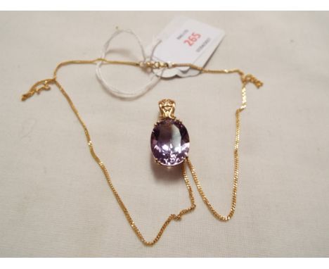 A 9ct gold amethyst set pendant and an 18" 9ct gold chain