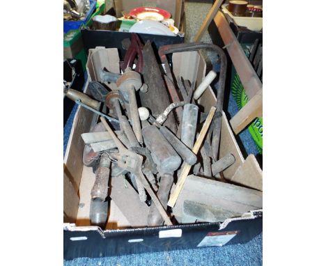 A quantity of vintage tools including saws, brace and bits, chisels, drills etc.