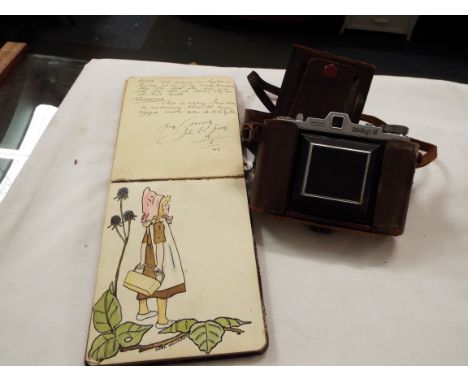 A vintage autograph book with poems etc including poems from wounded soldiers at The Battle of the Somme, together with a vin