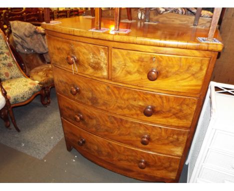 A Victorian mahogany bow fronted chest of two short over three long drawers having shaped apron resting on bracket feet 