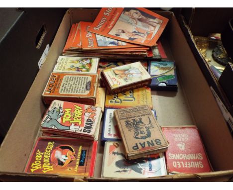 A box of assorted 1950's 'Enid Blyton' childrens books and a selection of childrens playing cards 