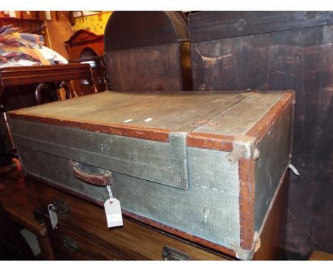 An early leather bound steamer trunk with fitted interior