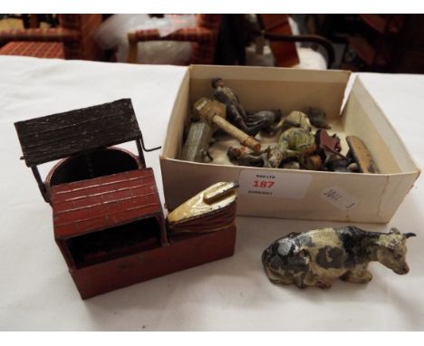 A small quantity of vintage lead figures and feathers from a farmyard, some Britains 