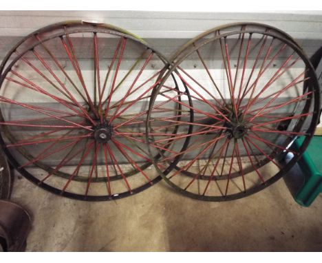 A set of four vintage metal cartwheels 
