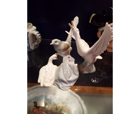 A Lladro goose, goose and gosling's and a Lladro wagtail