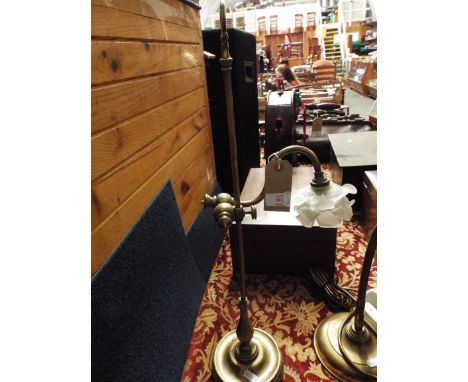 An art deco adjustable desk lamp with floral design frosted glass shade