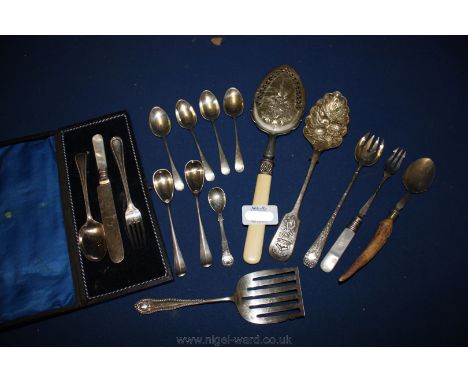 A cased Child's Knife, Fork and Spoon set and miscellaneous plated spoons, slice, pickle fork, etc.