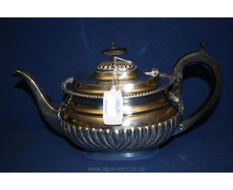 A silver Plated Teapot of rectangular shape.