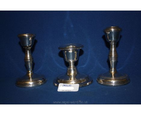 A pair of Silver Candlesticks, 4 1/4'' tall with some damage and a single Silver Candlestick, 3'' tall.