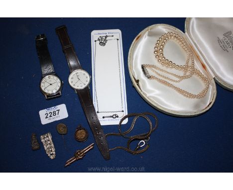 A Silver Chain with bagpipes charm, 9ct gold Brooch (broken), Timex quartz Gents Wristwatch plus one, and a string of simulat