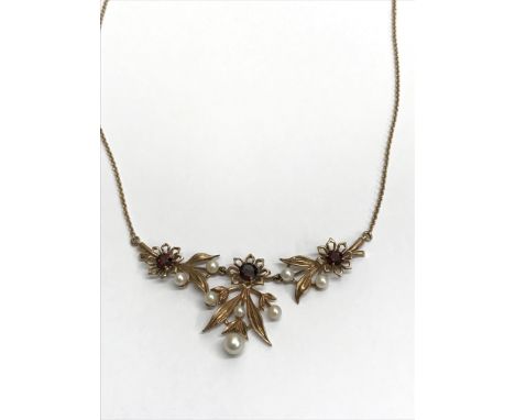 A 9ct gold garnet and pearl necklace.