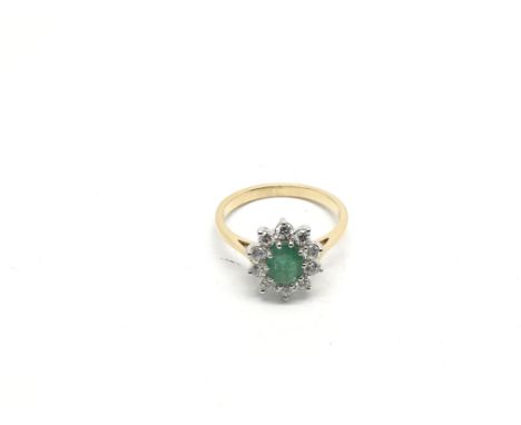 A certificated 18ct yellow and white gold oval cut emerald and diamond cluster ring, emerald approx 0.80ct, diamonds approx 0