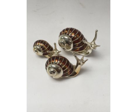 Three  miniature Snails in silver and enamel.