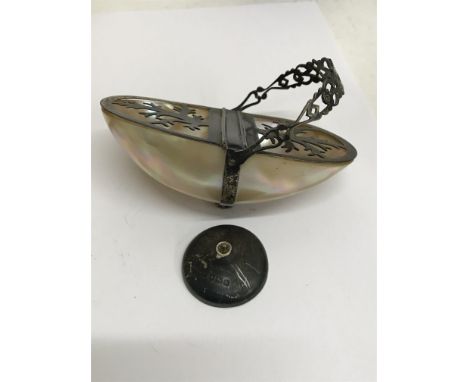 A small silver and mother of pearl basket with swing handle bae broken.