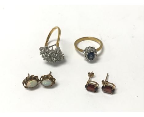 2 x stone set rings, a pair of garnet earrings and a pair of Opal earrings.