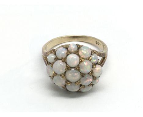 A 9ct gold ring set with opals, approx 3.4g and approx size K.
