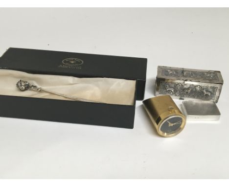 A silver letter opener by Sarah Jones a silver box decorated with raised animals an unusual Swiss manual wind table top watch