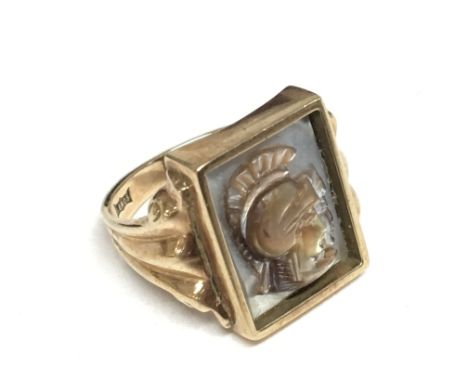 A 9carat gold ring set with mother of Pearl with Roman soldiers weight 8.6g