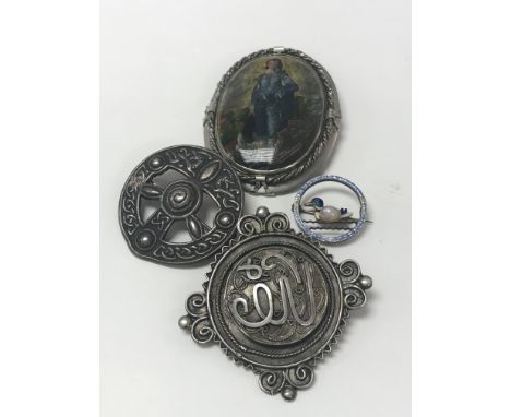 Four silver brooches - one is an islamic greeting brooch, one is an enamel and Pearl brooch of a duck, there is a silver Scot