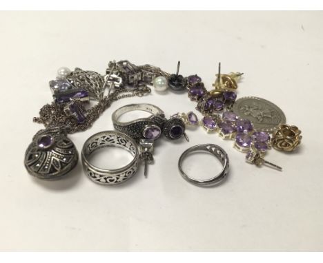A collection of amethyst set silver jewellery as well as other silver jewellery, Including a Simulated pearl necklace.