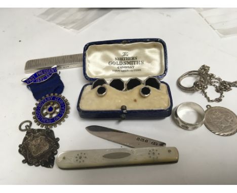 A silver sports medal a cased set of studs silver jewellery a mother of Pearl folding knife and other oddments ( a lot).