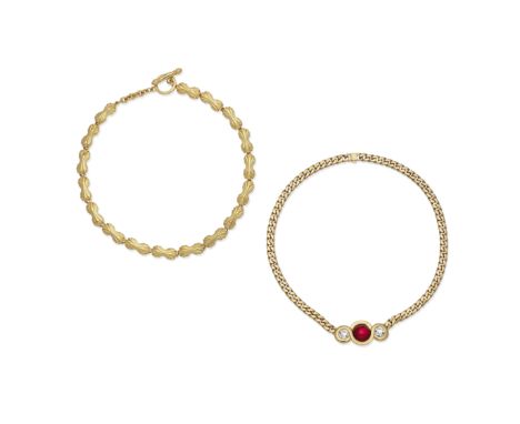 TWO GILT NECKLACESFendi, 1990sThe first with red glass and crystal design and flat curb chain, the second in gilt with logo d