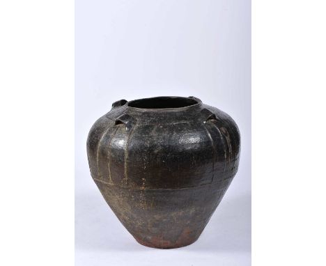 A «Martaban» spice pot, glazed ceramic in shades of dark brown, four rings to support the string, Southeast Asia, 16th/17th C