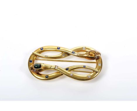 A brooch "snakes intertwined", gold, set with citrine, tourmaline, 7 round cut sapphires and 7 antique cut diamonds weighing 