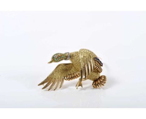 A "duck" brooch, 750/1000 gold, set with 8/8 cut emeralds, sapphires and diamonds, French, 20th C. (mid), signs of use, a rep