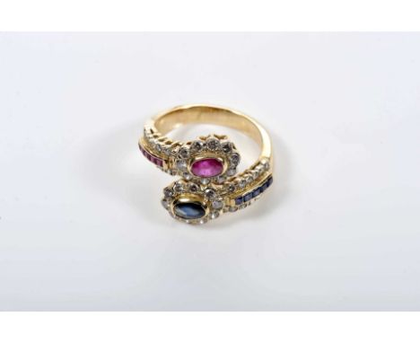 A ring, 800/1000 gold, set with calibrated sapphires and 1 oval cut sapphire, calibrated rubies and oval cut ruby, 44 brillia