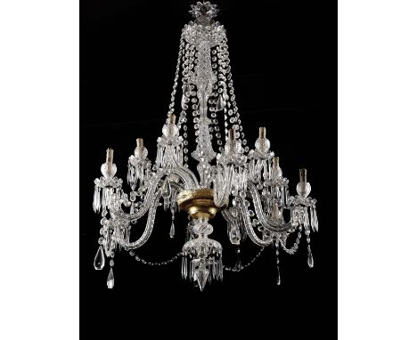 A twelve-light chandelier, gilt metal frame, glass and moulded and cut crystal arms and pendants, gilt glass goblet, Portugue