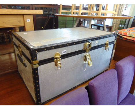 A cabin trunk and a wicker chest
