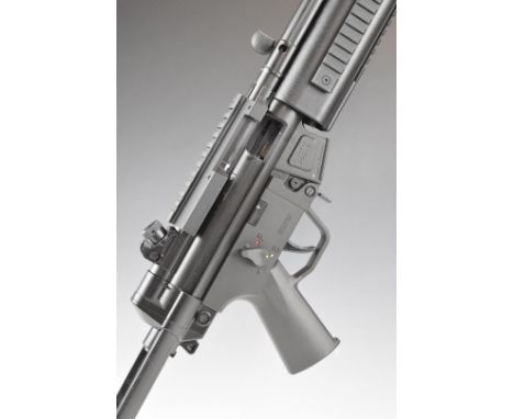 GSG-5 .22 semi-automatic assault style rifle with tactical stock, adjustable sights, sound moderator and 16 inch barrel, over