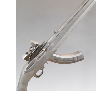 Ruger Model 10/22 .22 semi-automatic rifle with textured semi-pistol grip, composite stock, extended magazine, sling suspensi