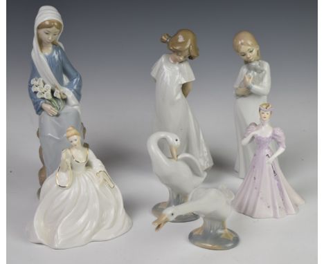 A collection of Lladro and Nao figures, tallest 24cm