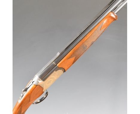 Bettinsoli Top 12 bore over and under ejector shotgun with engraved locks, underside, trigger guard and thumb lever, chequere