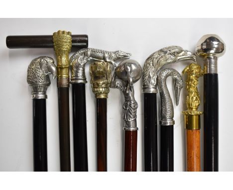 Nine walking sticks / canes including several by Roberto Cavagnini, others with mostly metal bird and animal handles and a Ro