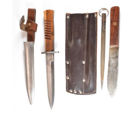 Replica German WW1 fighting knife with 15cm blade and scabbard, together with a throwing knife and sharpening steel, in leath