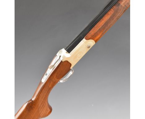 Yildiz SPZ 20 M 20 bore over and under shotgun with engraved scenes of birds to the lock and underside, chequered semi-pistol