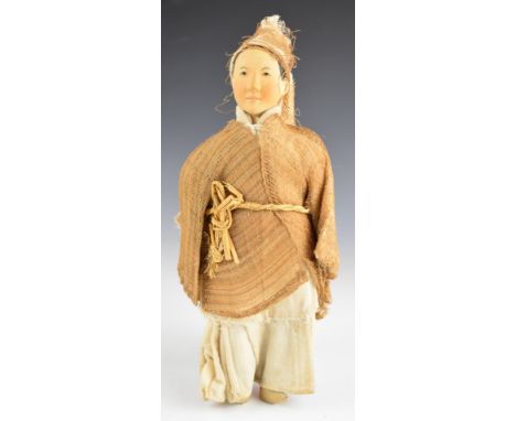 Chinese 'Door of Hope' peasant doll wearing a linen dress, straw work / hessian jacket and purple silk under trousers, with b