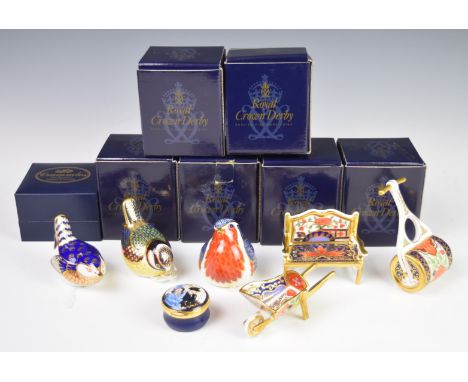 Royal Crown Derby Imari paperweights and miniatures including three birds, bench, garden roller and wheelbarrow, all boxed, t