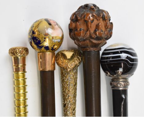 Five walking sticks / canes including a porcelain Queen Victoria portrait example dated 1837, banded agate, heart shaped exam