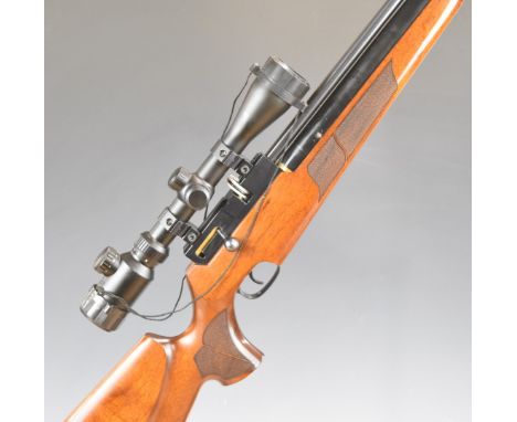 FX Login Solo .22 PCP air rifle with chequered semi-pistol grip and forend, raised cheek piece, 10 shot magazine, sound moder