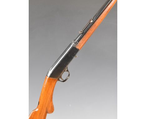 Browning .22 take-down rifle with semi-pistol grip, adjustable sights, sound moderator and 20 inch barrel, overall length 95.