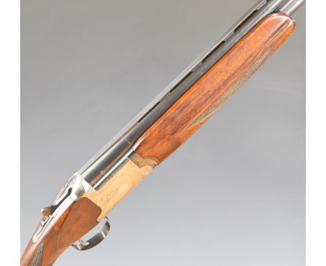 Nikko Model 5000 I 12 bore over and under ejector shotgun with engraved locks, trigger guard, underside, fences and thumb lev